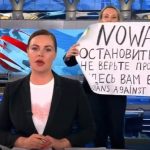 Woman Crashes Russian News With Anti-War Protest Sign