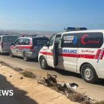 Libya floods: Flooded city buries its dead in mass graves