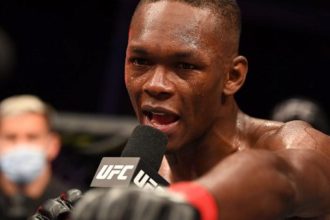 Israel Adesanya reacts to his defeat against Sean Strickland