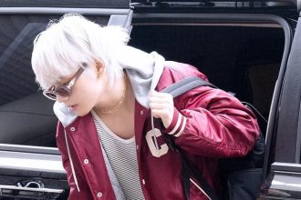 BTS’ V Rocked A Burgundy Varsity Jacket With His New Hair At Gimpo Airport