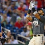 Dodgers endure long rain delay to earn win over Nats