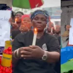 Ghana Traders Light Candles, Display Placards in Honour of Mohbad (Video)