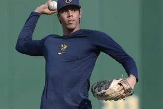 Brewers LF Christian Yelich (back) scratched